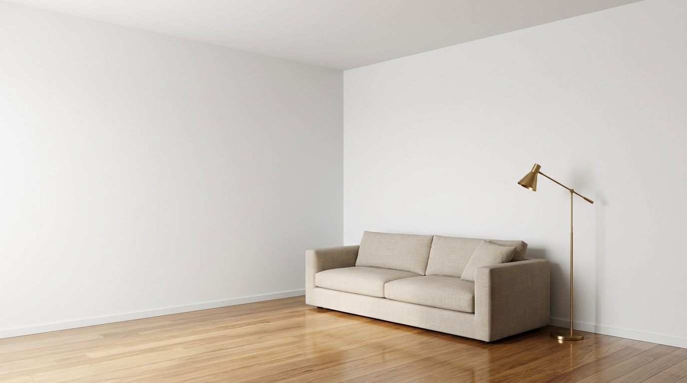 Living room with plain walls, sofa and floor lamp